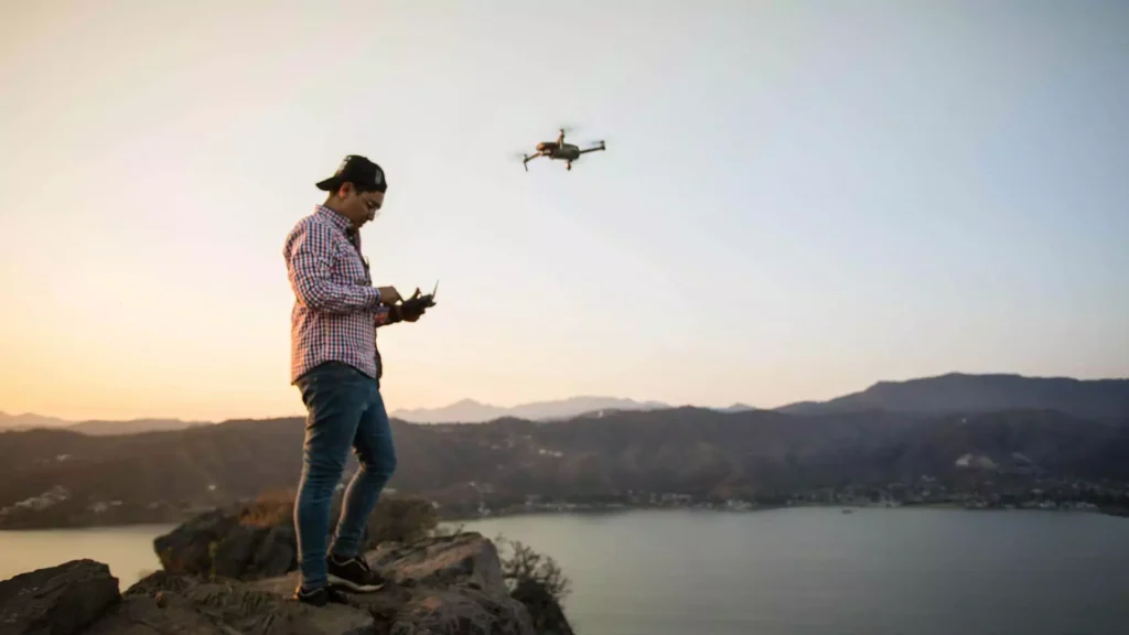 10 Great Ways to Make Money Using Your Drone A Picture of a person who is flying a drone
